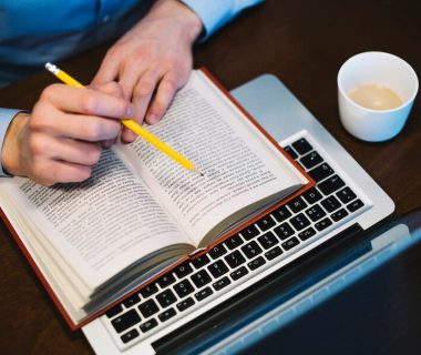crop-man-studying-near-laptop_23-2147779362