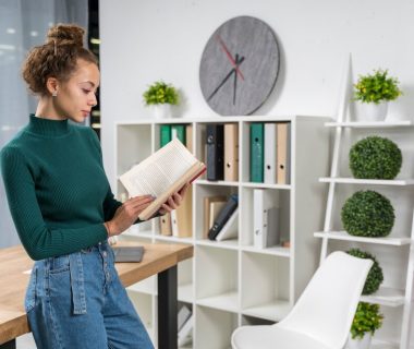 medium-shot-girl-with-book-indoors_23-2148389031